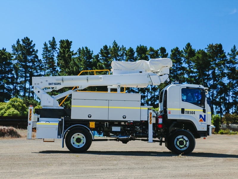 WEL Networks crew working on power lines with their Waimea Built specialist vehicles.
