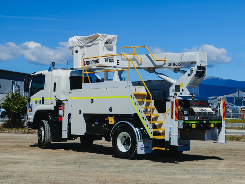 WEL Networks crew working on power lines with their Waimea Built specialist vehicles.