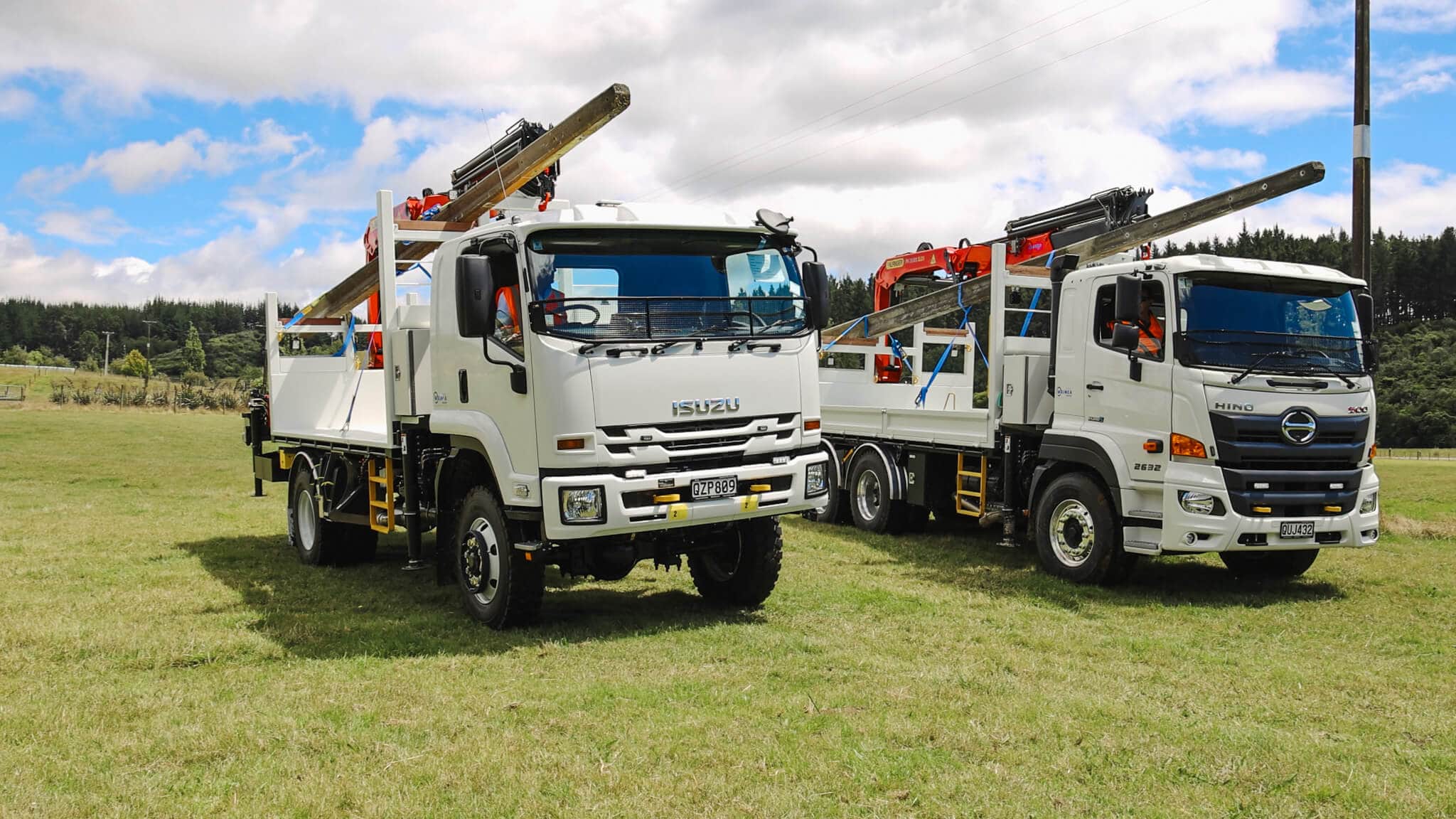 WEL Networks crew working on power lines with their Waimea Built specialist vehicles.