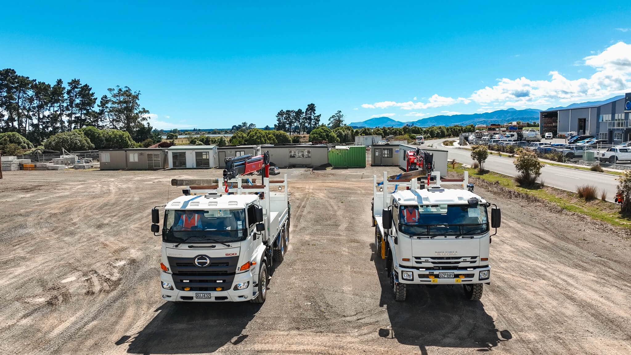 WEL Networks crew working on power lines with their Waimea Built specialist vehicles.
