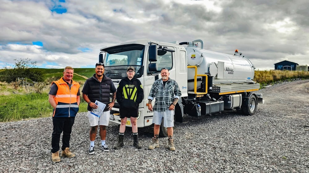 A new Allvac® liquid waste vacuum tanker truck with customer branding being handed over to customers