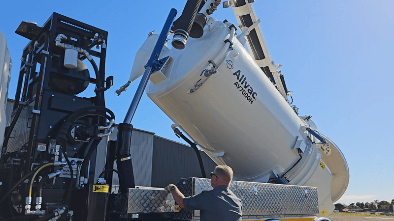 Waimea’s Allvac® hydrovac unit demonstrating pressurised tank discharge, showing slurry being expelled from the rear valve.