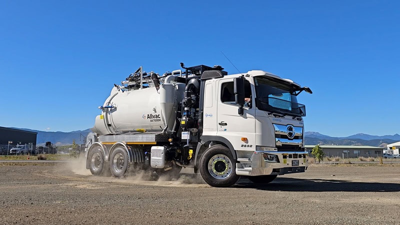 Waimea’s Allvac® hydrovac unit demonstrating pressurised tank discharge, showing slurry being expelled from the rear valve.