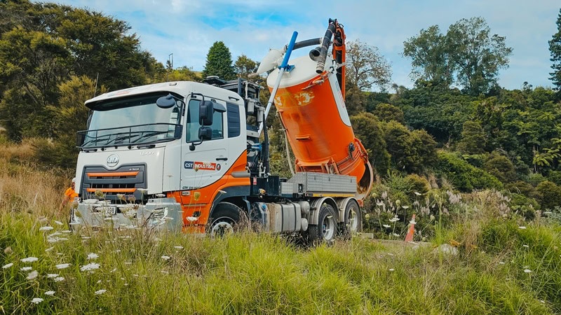 Waimea’s Allvac® hydrovac unit demonstrating pressurised tank discharge, showing slurry being expelled from the rear valve.