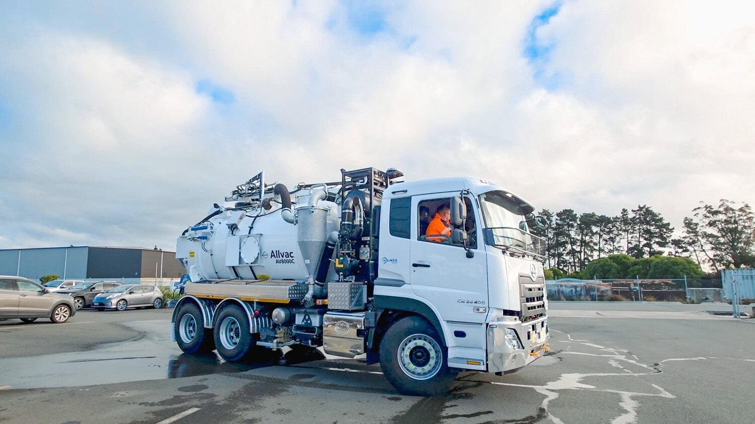 A hydrovac specialist vehicle being weighed with its front wheels on a weighbridge to find out how much of its payload is distributed on its front axle