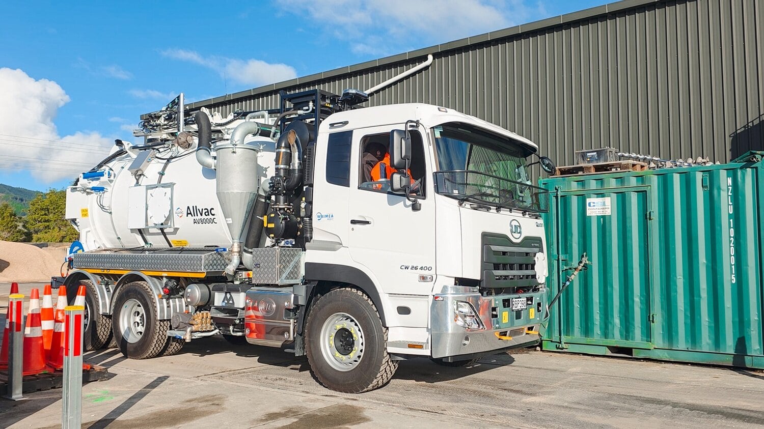 On scales A hydrovac specialist vehicle being weighed with its front wheels on a weighbridge to find out how much of its payload is distributed on its front axle