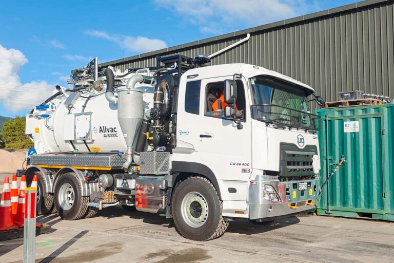 A hydrovac specialist vehicle being weighed with its front wheels on a weighbridge to find out how much of its payload is distributed on its front axle