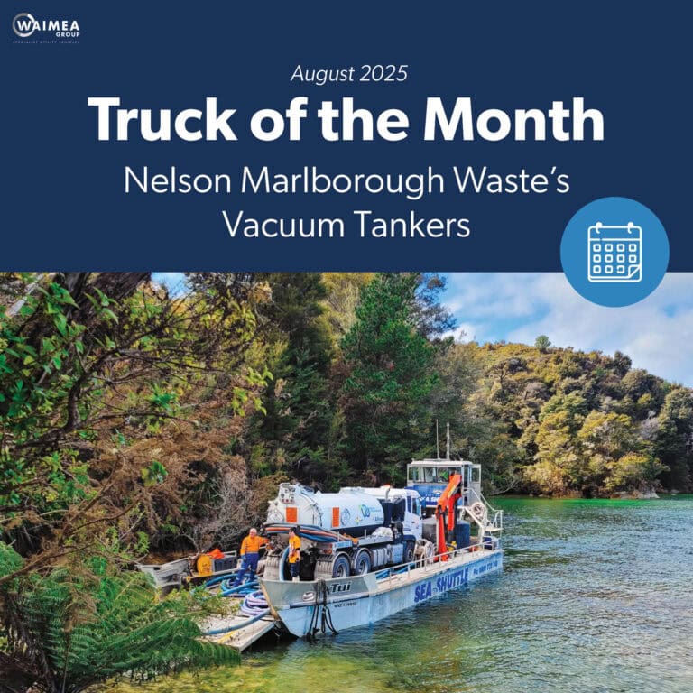 An Allvac® vacuum tanker truck on the back of a barge backed into a beautiful bay in the Abel Tasman National Park, removing liquid waste from a campsite.