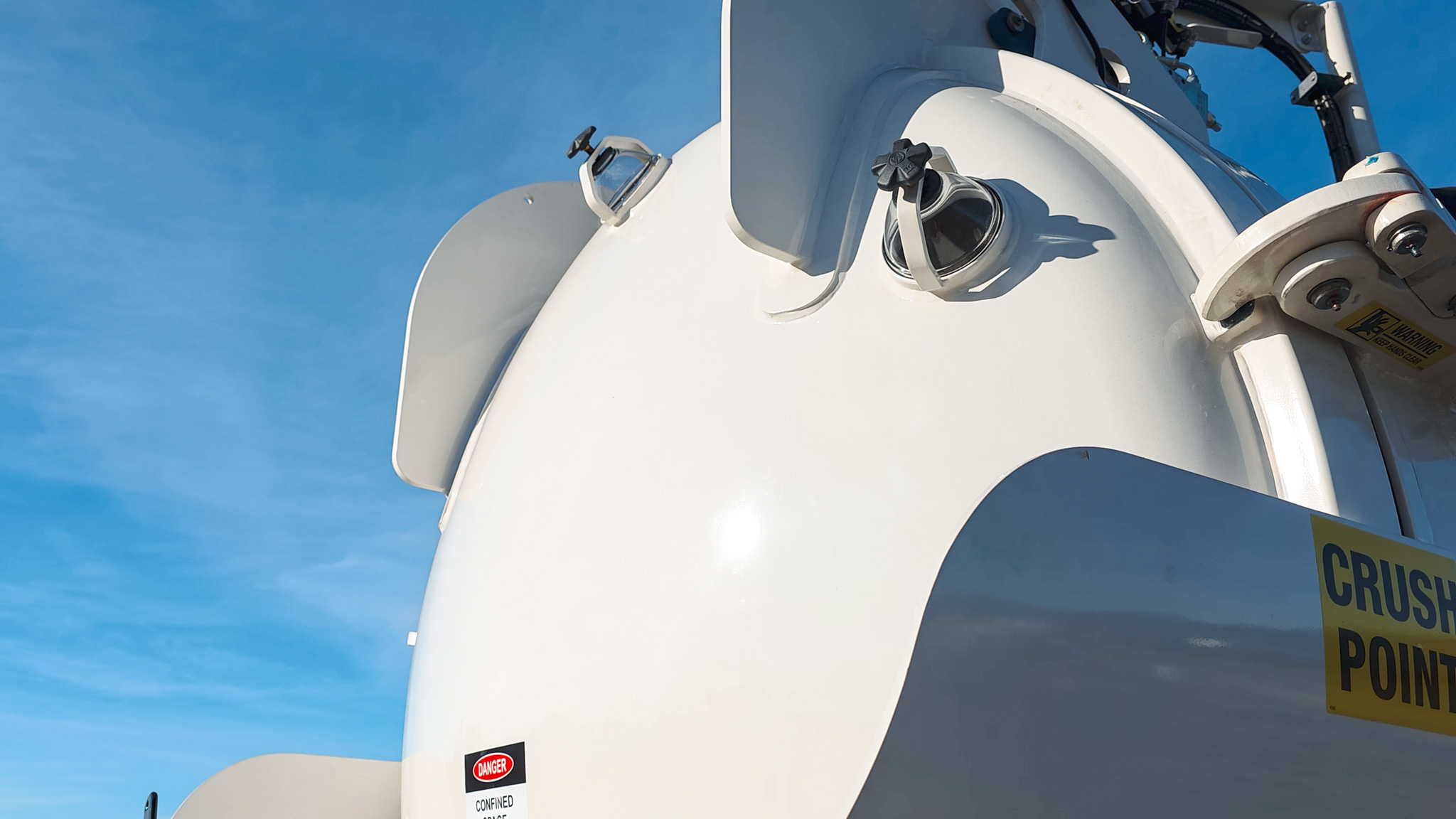 A close-up view of a hydrovac truck’s vacuum system where air is drawn into the tank to pressurise it.