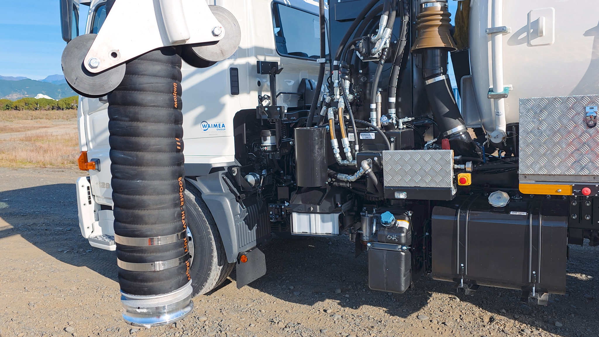 A close-up view of a hydrovac truck’s vacuum system where air is drawn into the tank to pressurise it.