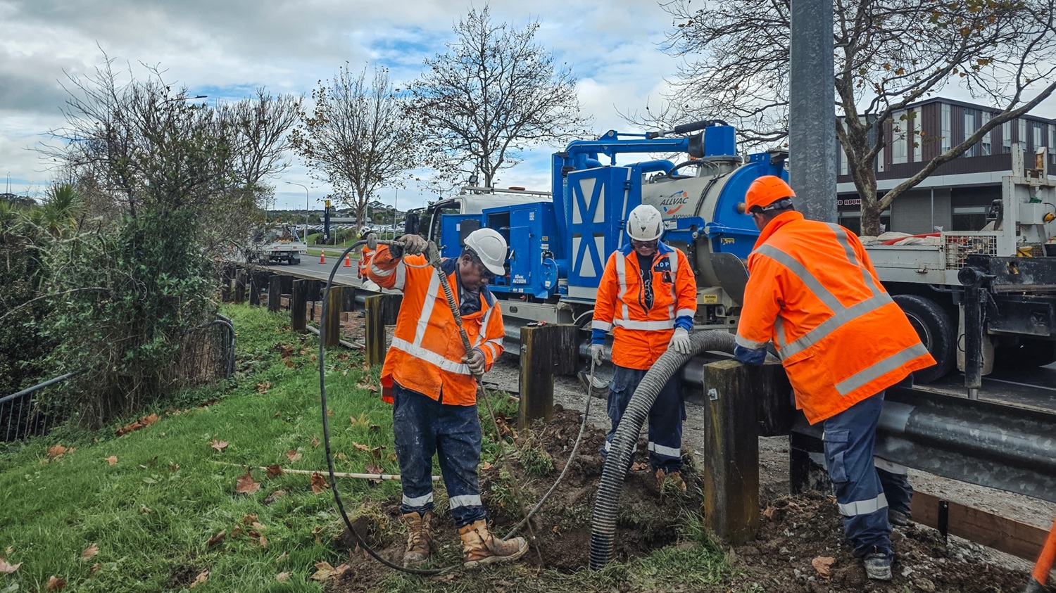 An Allvac® hydro excavation truck using a pressurised water lance and vacuum hose to expose underground pipes and cables at a New Zealand job site.