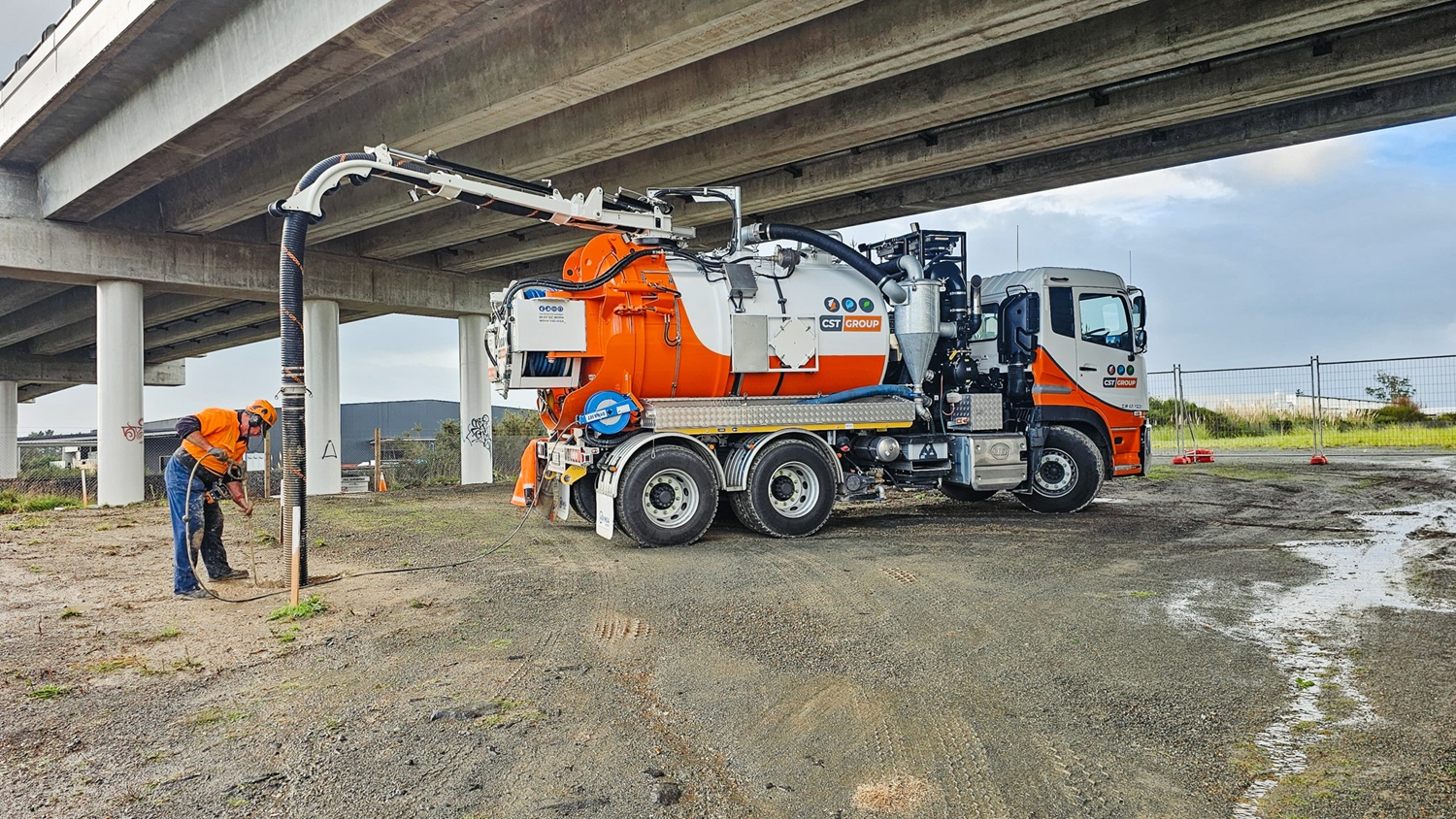 An Allvac® hydro excavation truck using a pressurised water lance and vacuum hose to expose underground pipes and cables at a New Zealand job site.